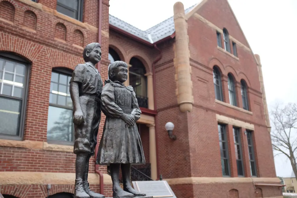 A photo of a statue in front of the main West Hills building